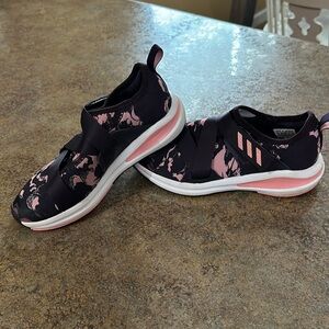 Girls pink and purple adidas.